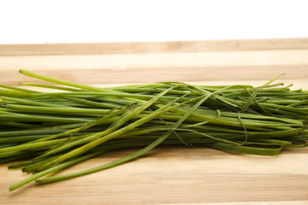 Fresh Chives on wooden plateの写真素材