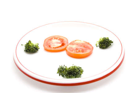 Tomato with Broccoli on Plateの写真素材