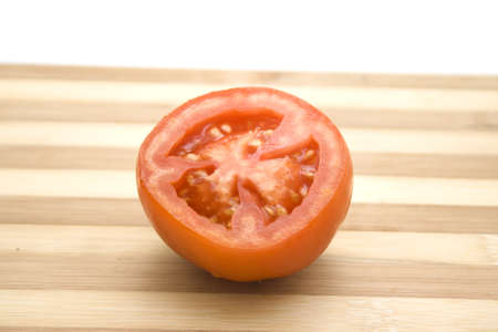 Fresh Red Tomato on wooden plate の写真素材
