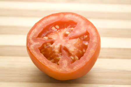 Fresh Red Tomato on wooden plate の写真素材