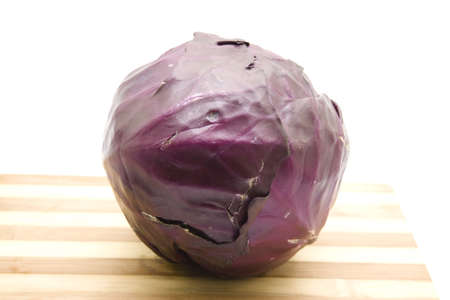 Fresh Red Cabbage on wooden plate の写真素材