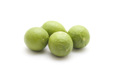 Green Lemon on white background の写真素材