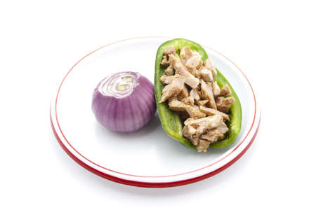 Filling Bell Pepper with Meat and Onion on Plate の写真素材