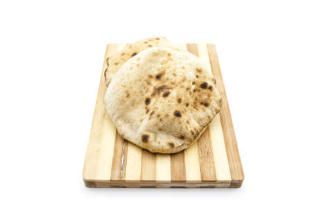 Baked Egypt Bread  on wooden plateの写真素材
