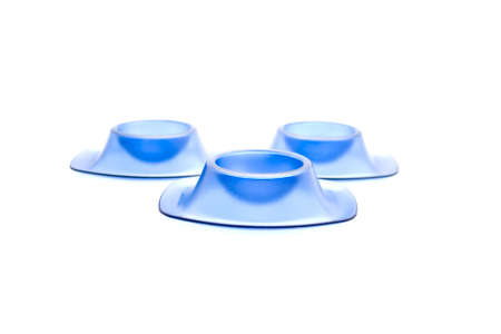 Blue egg cup for Eggs on white background の写真素材