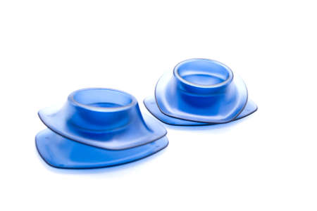 Blue egg cup for Eggs on white background の写真素材