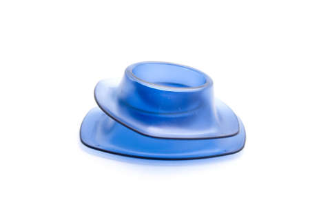Blue egg cup for Eggs on white background の写真素材