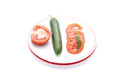 Fresh Tomatos with Cucumber on Plastic Plate の写真素材