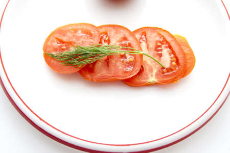 Fresh Tomatos on Plastic Plate の写真素材