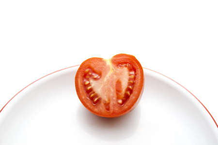 Fresh Tomatos on Plastic Plate の写真素材