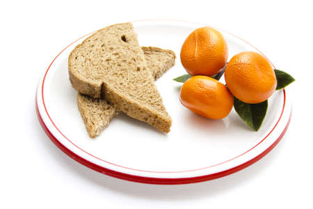 Plastic Tangerine  with Bread on Plastic Plate の写真素材