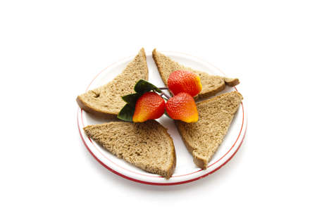 Plastic Strawberries  with Bread on Plastic Plate の写真素材