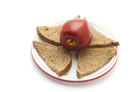 Plastic Apple with Bread on Plastic Plate の写真素材