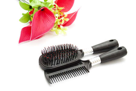 Different Hairbush with red flower on white background の写真素材