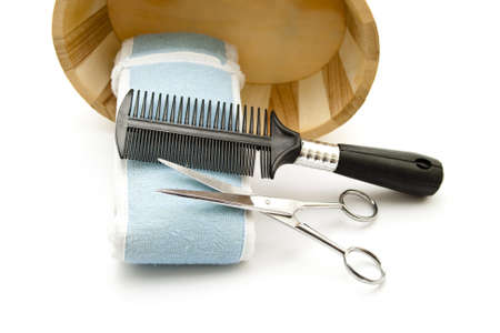 Hairbrush with Scissors and Blue Cloth の写真素材