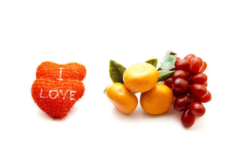 Plastic Fruits with Red Hearts の写真素材