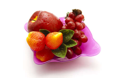 Plastic Fruits in glass bowl の写真素材