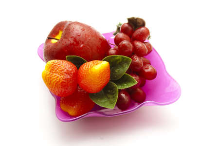 Plastic Fruits in glass bowl の写真素材