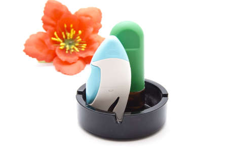Nasal Spray with Asthma Inhaler in Ashtray の写真素材