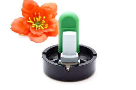 Nasal Spray with Asthma Inhaler in Ashtray の写真素材