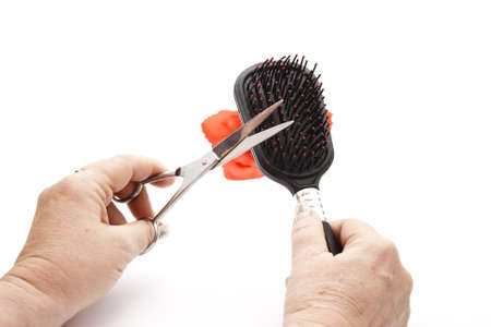 Hairscissors and Hairbrush in hand 