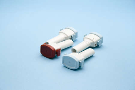 Asthma Inhaler on blue background の写真素材