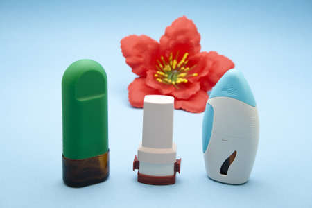 Nasal Spray with Asthma Inhaler on blue background の写真素材