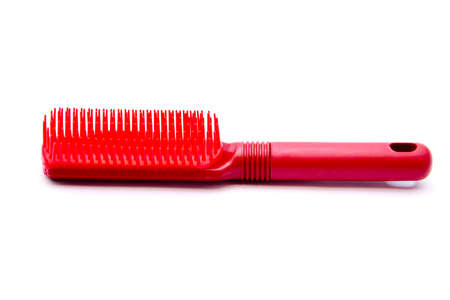 Red Plastic hairbrush on white background の写真素材