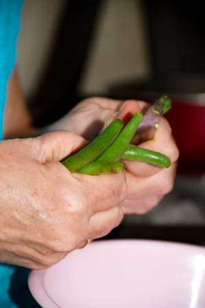 Sliced Green Stick Beans in Hand with Knife 
