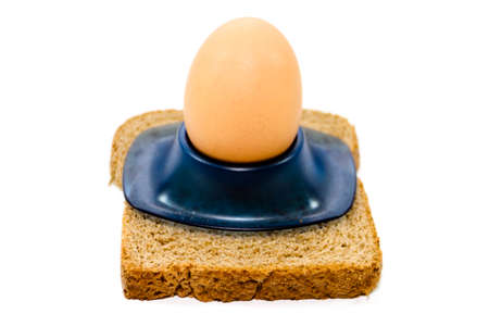 Fresh Brown Egg in Egg Cup with Toast Bread 