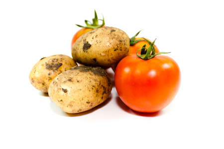 Fresh Red Tomatoes and Brown Potatoesの写真素材