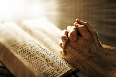 praying over a bibleの写真素材