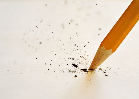 The lead of the pencil breaking after pressing down too hard.の写真素材