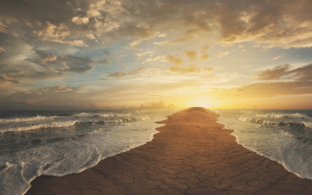 The oceans are divided and leaving a narrow strip of sand.の写真素材