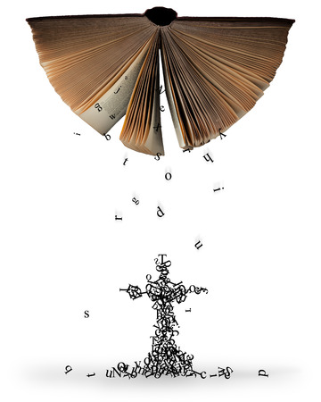 Letters falling out of an open Bible that make the shape of a cross.の写真素材