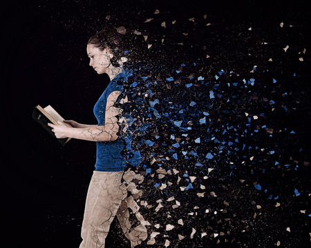 A woman reads a Bible and her body breaks to many pieces.の写真素材