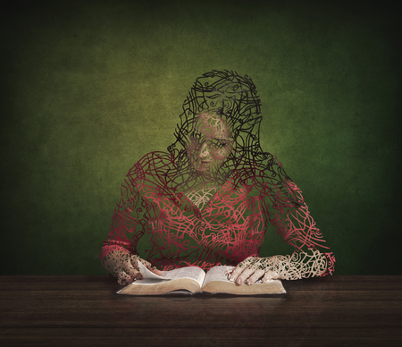 A woman is restored by reading her Bible.の写真素材