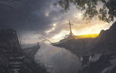 A man grabs a root connected to a crossの写真素材
