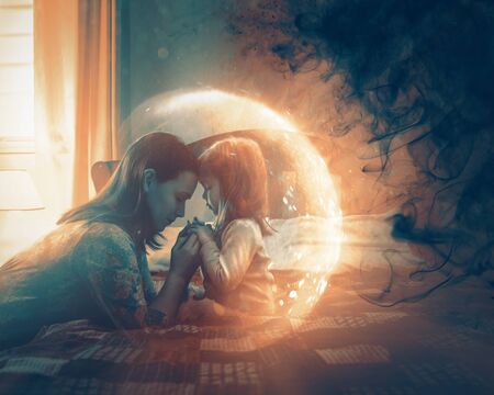 A mother praying for her child and a light shines around to protect from darkness