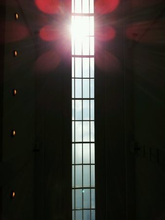 Flare through the roof of a building