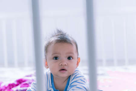 A cute little girl looking into the camera.