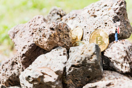 Cryptocurrency concept with bitcoins in bitcoin mine.の写真素材