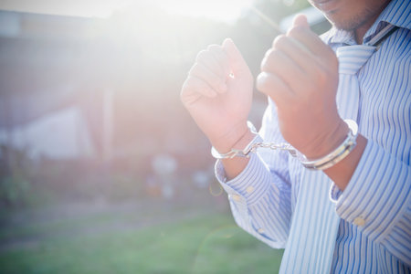 Businessman or politician with handcuffs.の写真素材