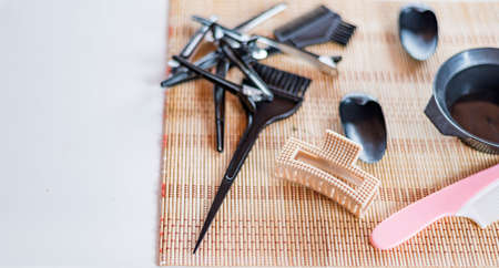 Close-up of hairdressing tools on a wooden table.の写真素材