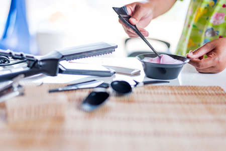 Close-up of hairdressing tools on a wooden table.の写真素材