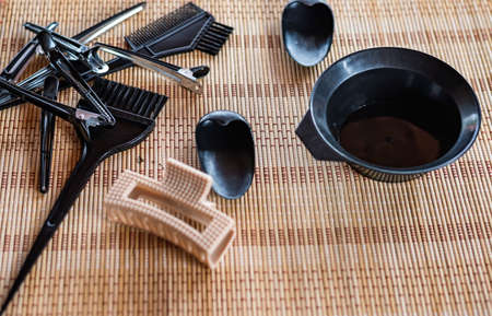 Close-up of hairdressing tools on a wooden table.の写真素材