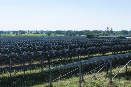 Background of photovoltaic cell farm or solar panels field eco friendly and clean energyの写真素材
