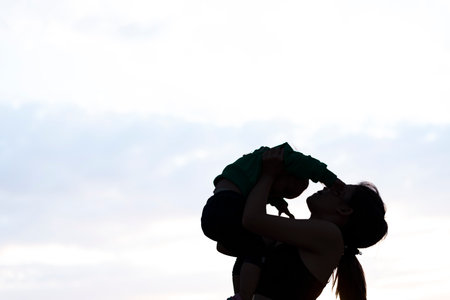 mother and a child. Mother`s day background. Mother and child silhouette.clipping mask.の写真素材