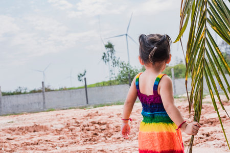Asian girls study wind turbines to generate electricity. Sustainable energy. future.の写真素材