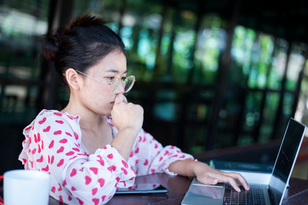 Sad unemployed young smart asian woman, student, looking for a job, hoping to get a dream job, asking for support.の写真素材